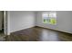 This bedroom has wood laminate floors, natural lighting, and neutral paint at 14584 Hinton Dr, Fishers, IN 46037