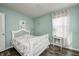 Stylish bedroom featuring a white bed frame, hardwood floors, and a whimsical unicorn wall decal at 14584 Hinton Dr, Fishers, IN 46037