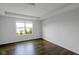 A bright bedroom featuring laminate flooring, neutral paint, and natural lighting at 14584 Hinton Dr, Fishers, IN 46037