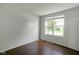 Simple bedroom with hardwood floors, a window, and neutral walls at 14584 Hinton Dr, Fishers, IN 46037