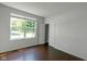 Bright bedroom with hardwood floors, large window, and a closet at 14584 Hinton Dr, Fishers, IN 46037
