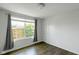 Cozy bedroom with laminate flooring, a window with gray curtains at 14584 Hinton Dr, Fishers, IN 46037