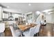 Spacious dining area features a rustic wood table and stylish seating at 14584 Hinton Dr, Fishers, IN 46037