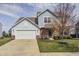 Charming two-story home with attached garage and manicured front yard at 14584 Hinton Dr, Fishers, IN 46037