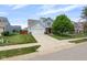 Attractive two-story home boasts a two-car garage, a spacious driveway, and a lush green lawn at 14584 Hinton Dr, Fishers, IN 46037