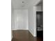 Entryway featuring wood floors, neutral walls, and access to a half bathroom at 14584 Hinton Dr, Fishers, IN 46037