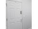 Modern white front door with security lock adding a sleek and secure point of entry to the property at 14584 Hinton Dr, Fishers, IN 46037