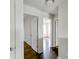 Hallway features wood floors and white doors to bedrooms at 14584 Hinton Dr, Fishers, IN 46037