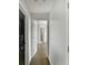View of the hallway featuring wood floors and entryways to bedrooms at 14584 Hinton Dr, Fishers, IN 46037