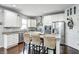 Modern kitchen with stainless steel appliances, granite countertops, and a breakfast bar at 14584 Hinton Dr, Fishers, IN 46037