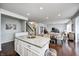Open concept kitchen featuring an island and dining area with hardwood floors at 14584 Hinton Dr, Fishers, IN 46037