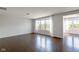 Spacious living room with hardwood floors and bright windows, creating an open and inviting living space at 14584 Hinton Dr, Fishers, IN 46037