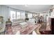 Open-concept living room with seamless flow to the kitchen and dining area at 14584 Hinton Dr, Fishers, IN 46037