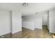 Upstairs loft featuring wood floors, neutral walls, and a doorway leading to a bedroom at 14584 Hinton Dr, Fishers, IN 46037