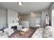 Bright and inviting loft features a fireplace, comfortable seating, with plush textiles and ample natural light at 14584 Hinton Dr, Fishers, IN 46037