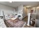 This bright and inviting loft features an area for the to play or read, a couch, and a decorative fireplace at 14584 Hinton Dr, Fishers, IN 46037