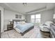Serene primary bedroom featuring a tray ceiling, natural light, a patterned rug, and a comfortable seating area at 14584 Hinton Dr, Fishers, IN 46037