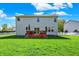 Exterior of home featuring a well-maintained backyard, deck, and white picket fence at 14817 Deerwood Dr, Carmel, IN 46033
