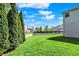 Spacious backyard with healthy lawn, framed by a white picket fence and a soccer goal at 14817 Deerwood Dr, Carmel, IN 46033