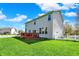 Spacious backyard featuring a deck and lush green lawn, perfect for outdoor activities at 14817 Deerwood Dr, Carmel, IN 46033