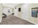 Basement area with carpet, multiple doors, and a basketball hoop at 14817 Deerwood Dr, Carmel, IN 46033