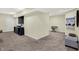 Finished basement offers neutral carpet, entertainment area, and potential play space at 14817 Deerwood Dr, Carmel, IN 46033