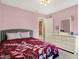Comfortable bedroom with a bed, dresser, and a view into an adjacent room at 14817 Deerwood Dr, Carmel, IN 46033