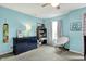 Relaxing bedroom with a dark dresser, a comfortable chair, and neutral colors at 14817 Deerwood Dr, Carmel, IN 46033