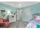 Bright bedroom with soft turquoise walls, carpet, and an open doorway at 14817 Deerwood Dr, Carmel, IN 46033