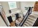 Grand foyer with hardwood floors, a chandelier, and a staircase, creating a welcoming entrance at 14817 Deerwood Dr, Carmel, IN 46033
