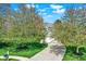 Traditional home with an inviting driveway lined by vibrant trees at 14817 Deerwood Dr, Carmel, IN 46033