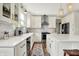 Beautiful kitchen with modern appliances, white quartz countertops, herringbone backsplash and stylish gold hardware at 14817 Deerwood Dr, Carmel, IN 46033