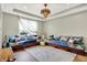 Relaxing living area with hardwood floors, built-in seating, and a statement light fixture, ideal for lounging at 14817 Deerwood Dr, Carmel, IN 46033