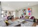Inviting living room flowing into the dining area and kitchen with a modern open concept at 14817 Deerwood Dr, Carmel, IN 46033