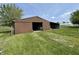 Large barn with an open side, set in a grassy field at 1598 Commerce Way, Pittsboro, IN 46167