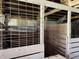 Interior of a barn with wooden stalls at 1598 Commerce Way, Pittsboro, IN 46167