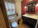 Cozy bathroom featuring a toilet, vanity, and window at 1598 Commerce Way, Pittsboro, IN 46167