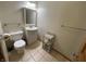 Bathroom featuring a toilet, sink with vanity, and tiled floors at 1598 Commerce Way, Pittsboro, IN 46167
