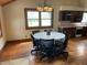 Dining room with hardwood floors, chandelier, and a view of the backyard at 1598 Commerce Way, Pittsboro, IN 46167