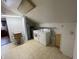 Laundry room featuring washer, dryer, water heater, and cabinets at 1598 Commerce Way, Pittsboro, IN 46167