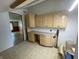 Laundry room featuring upper and lower cabinets and tiled flooring at 1598 Commerce Way, Pittsboro, IN 46167