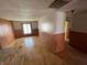 Wood-paneled room featuring hardwood floors and a window at 1598 Commerce Way, Pittsboro, IN 46167