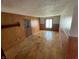 Wood-paneled room featuring hardwood floors and a window at 1598 Commerce Way, Pittsboro, IN 46167