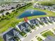 Aerial view of homes with a pond featuring a water fountain in the Millers Walk neighborhood at 17023 Adler Ln, Noblesville, IN 46060