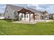 Beautifully landscaped backyard featuring a charming pergola and lush green lawn at 17023 Adler Ln, Noblesville, IN 46060