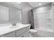 Bathroom showcasing a white vanity, shower with tile surround, and modern fixtures at 17023 Adler Ln, Noblesville, IN 46060