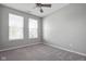 Carpeted bedroom with fan and large windows at 17023 Adler Ln, Noblesville, IN 46060