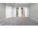 Carpeted bedroom with walk-in closet and bathroom entrances at 17023 Adler Ln, Noblesville, IN 46060
