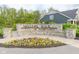 Stone entrance sign for Millers Walk of Noblesville with colorful flowerbed at 17023 Adler Ln, Noblesville, IN 46060