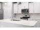 Contemporary kitchen featuring white cabinets, a breakfast bar, and stainless-steel appliances at 17023 Adler Ln, Noblesville, IN 46060